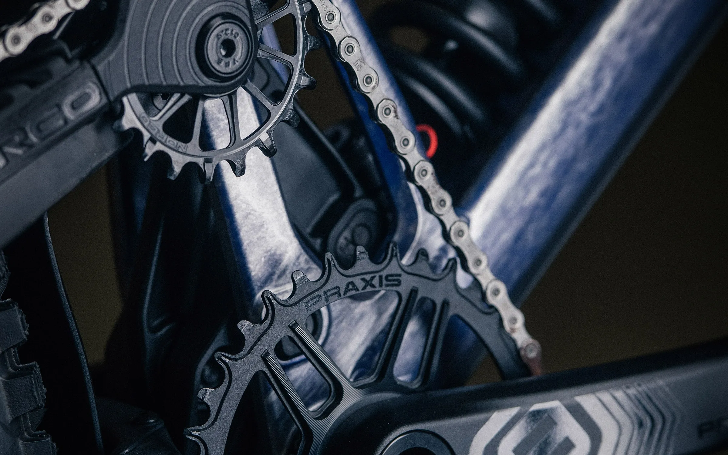 The idler pulley, chainring and crank, with the coil shock behind