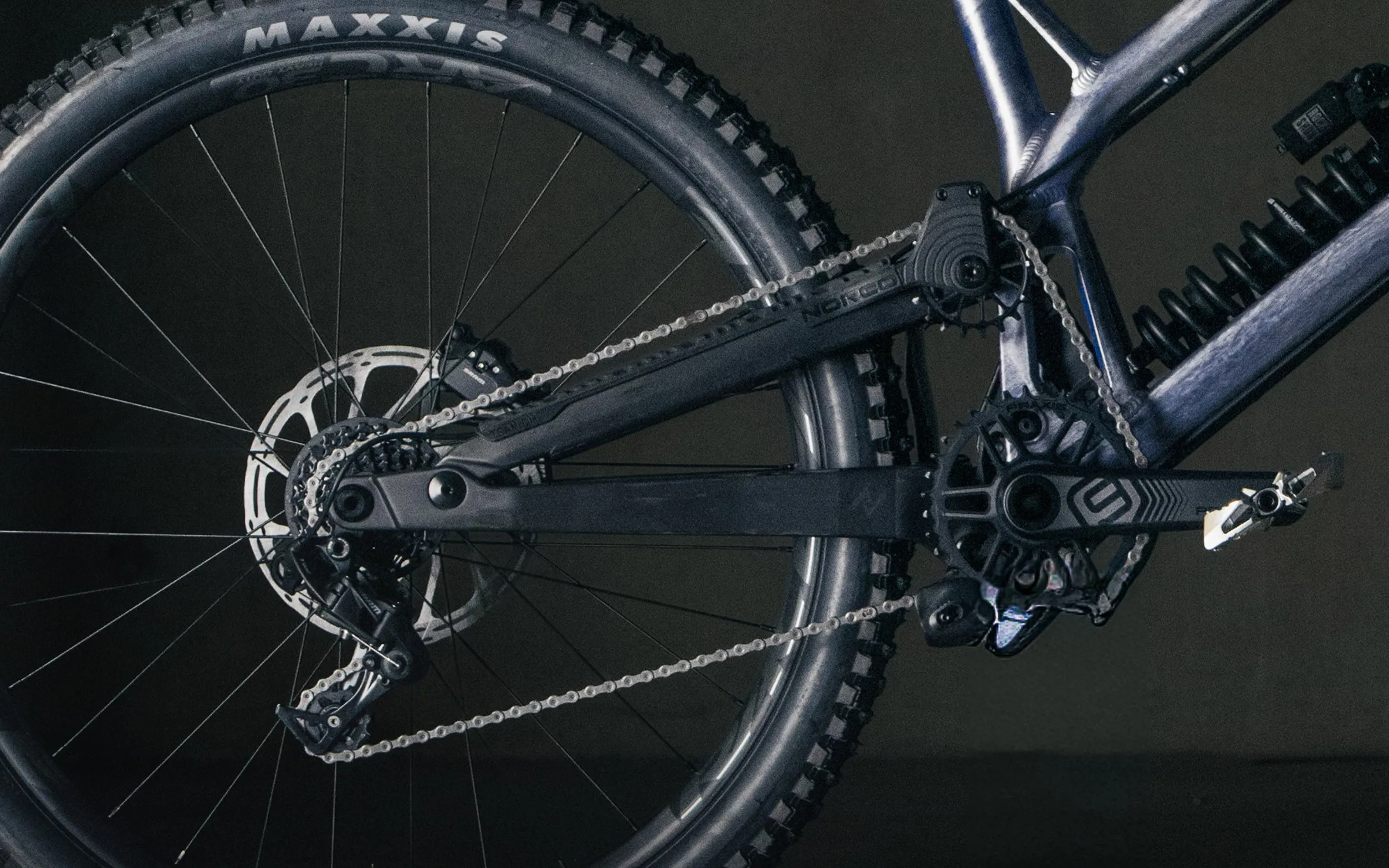 The Team DH's drive side: rear wheel, cassette, derailleur and carbon chainstay
