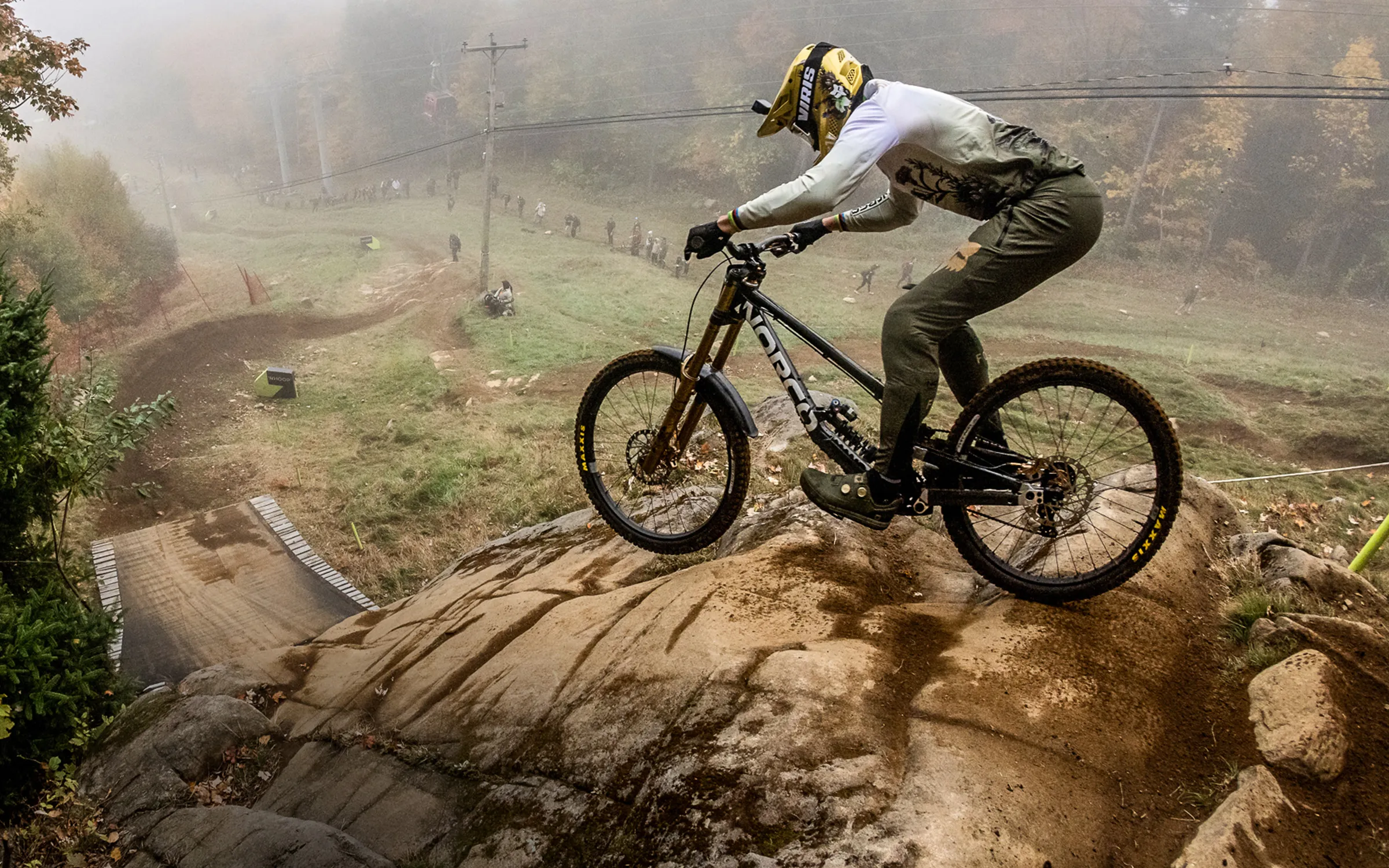 Rider cornering hard through dust