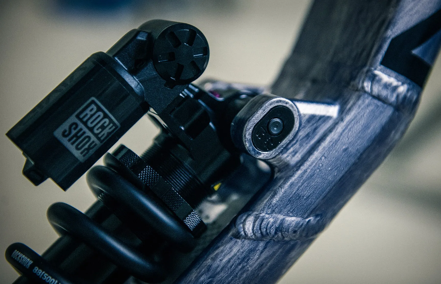 The Team DH's rear shock and Progression Adjust hardware in close detail