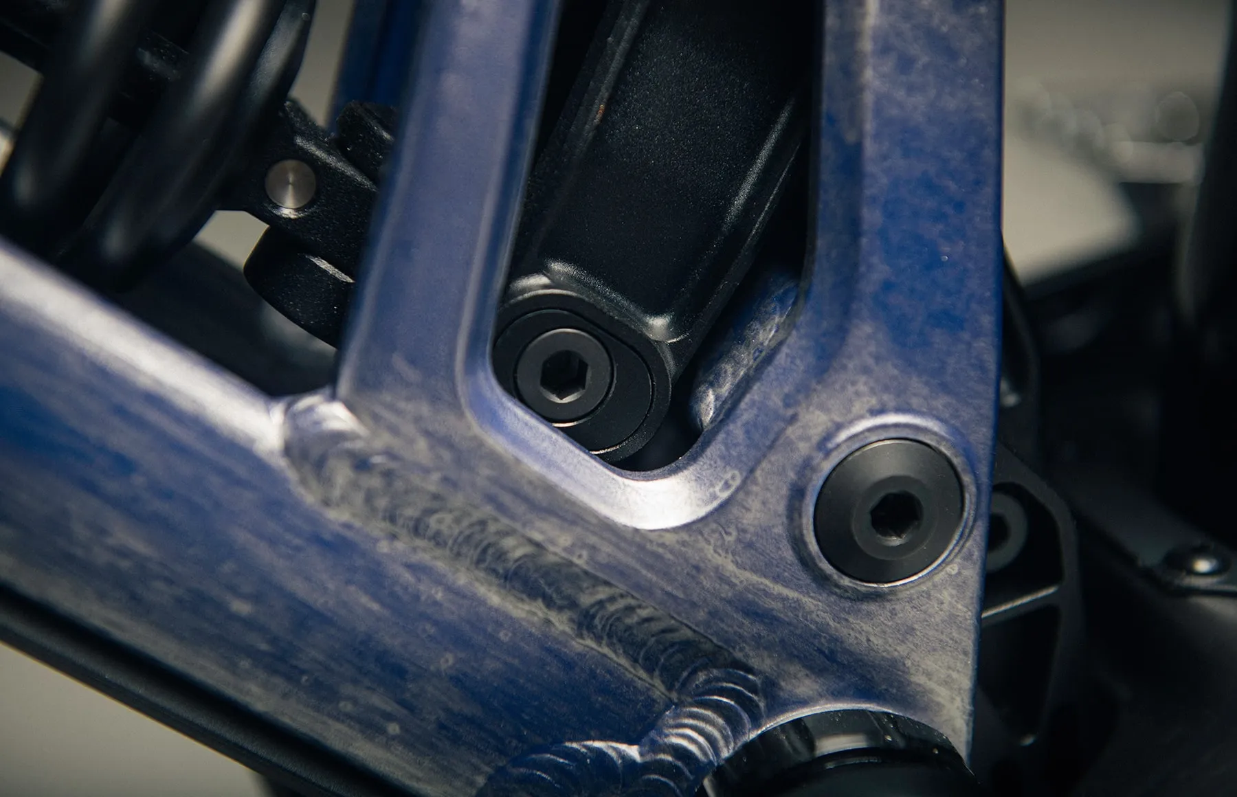 The Team DH's rear shock and Progression Adjust hardware in close detail