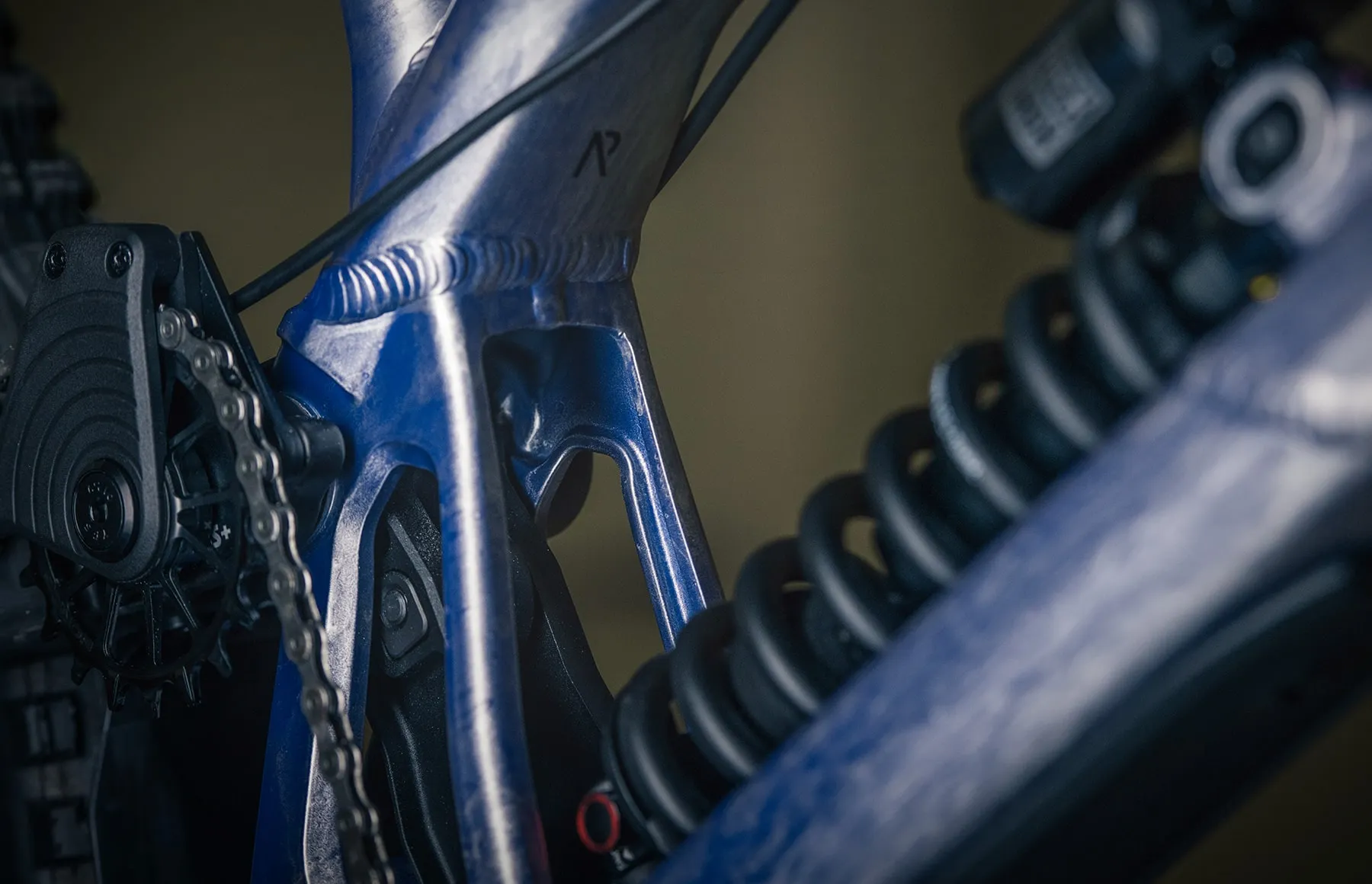 The Team DH's raw alloy front triangle with the Norco mark