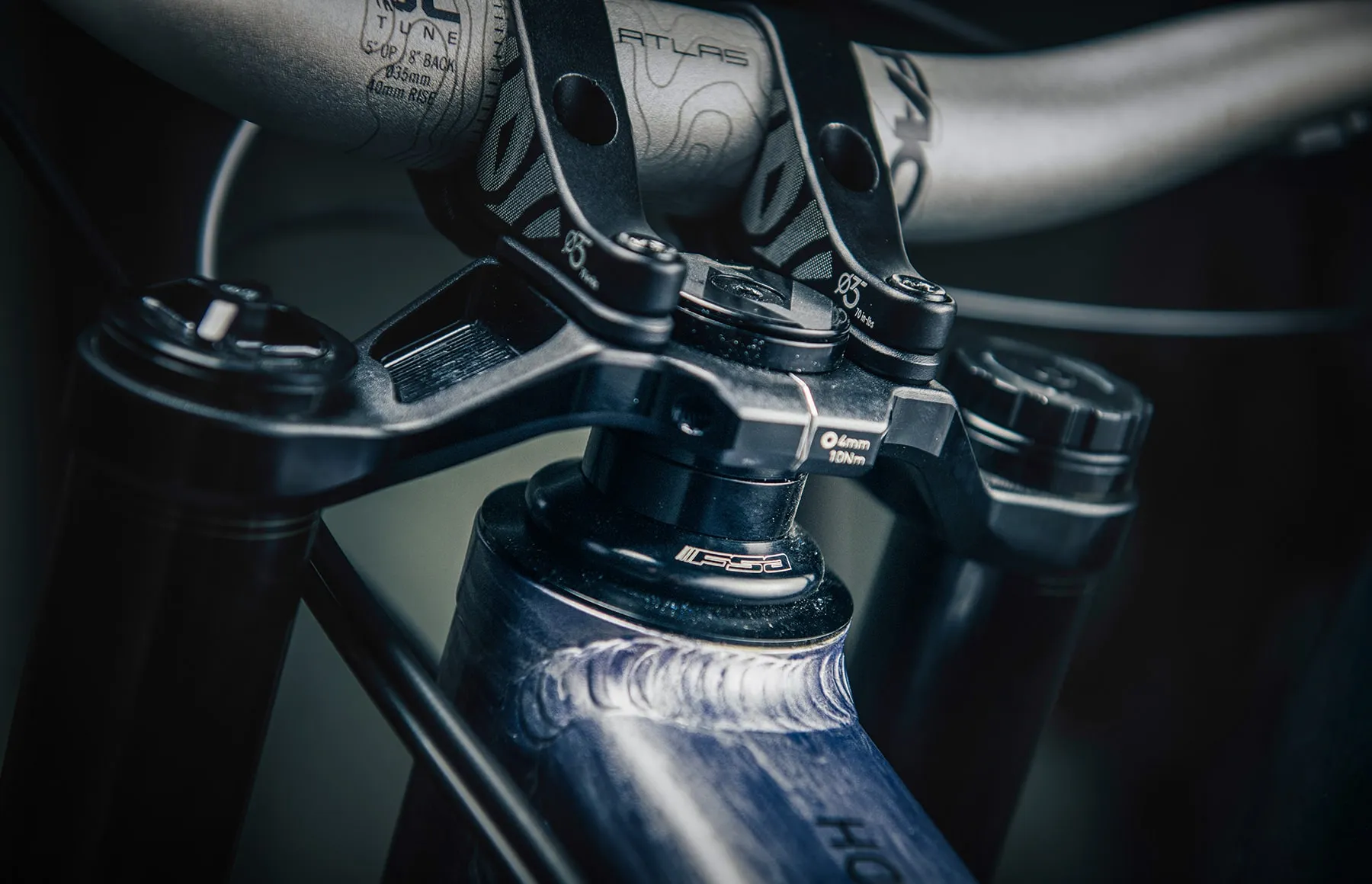 The Team DH's machined HVP-6 linkage, shot close in low workshop light